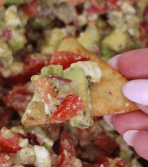 Creamy avocado feta dip topped with diced avocado, crumbled feta cheese, fresh herbs, red pepper flakes, olive oil, and black pepper. Served with toasted crostini, this easy avocado dip is a fresh, flavorful appetizer perfect for parties, summer gatherings, and entertaining.