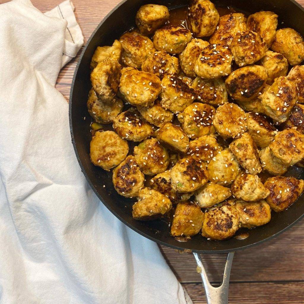 asian chicken meatballs in pan