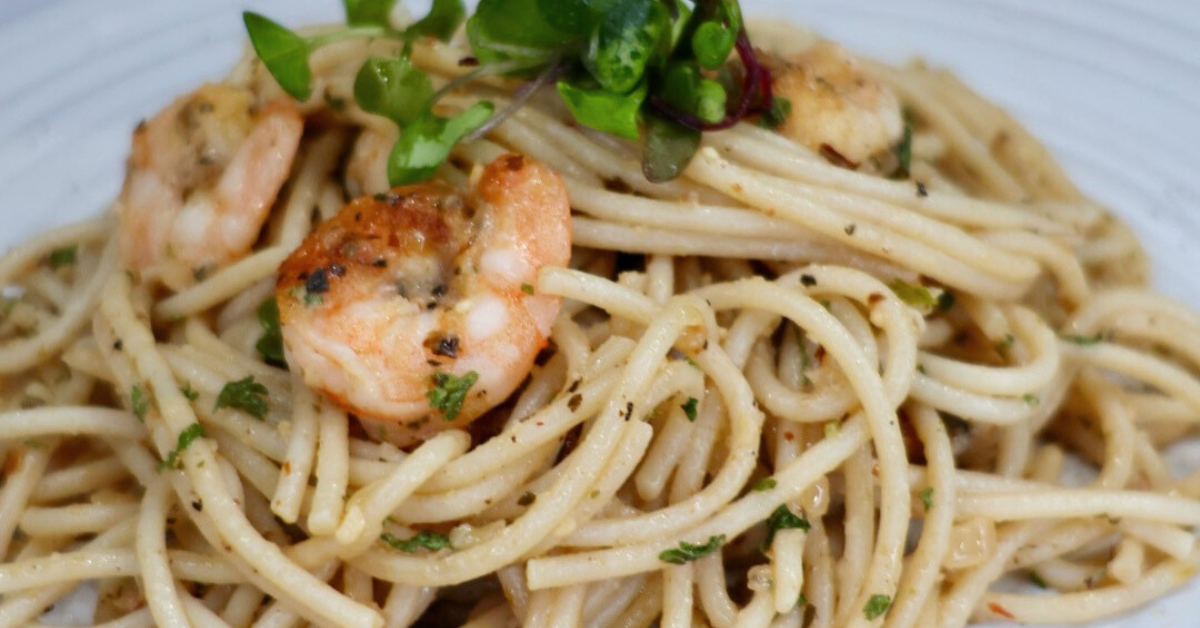 Garlic butter noodles with shrimp in skillet