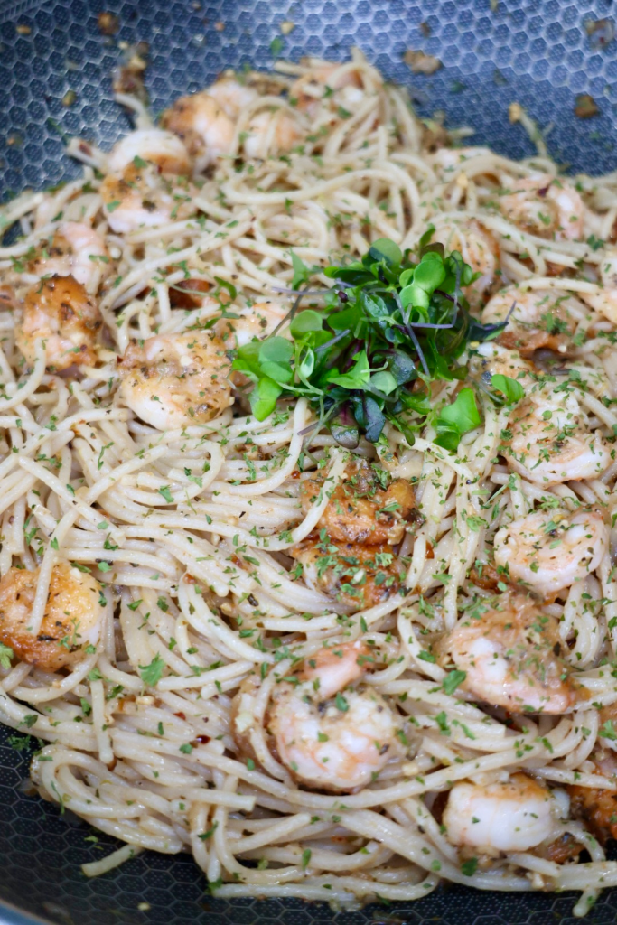Garlic butter noodles with shrimp in skillet