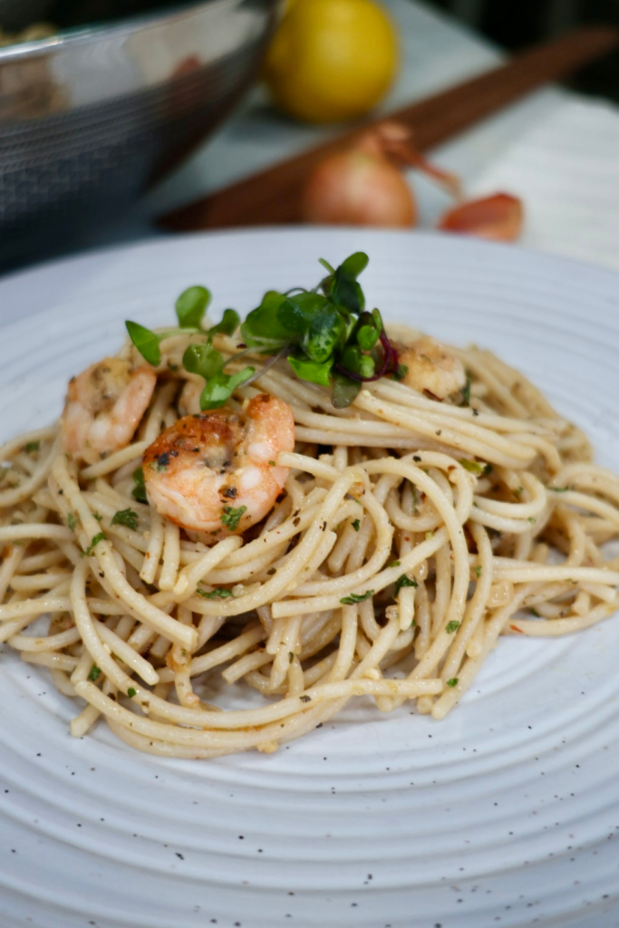 Garlic butter noodles with shrimp in skillet