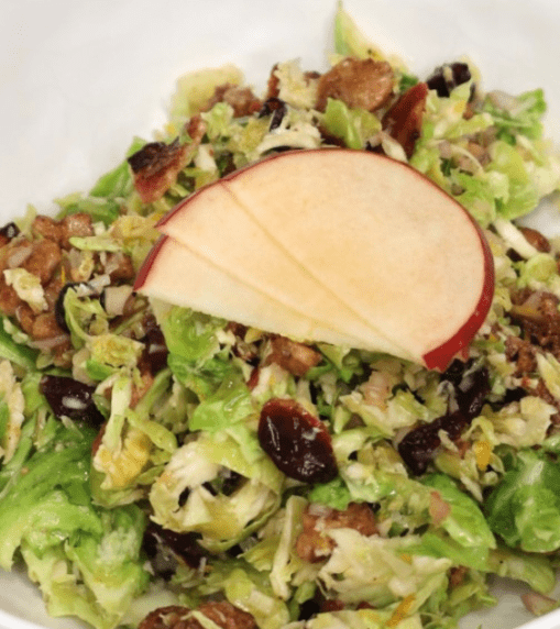 brussels sprouts salad with candied walnuts and orange vinaigrette for fall. healthy fall salad recipe