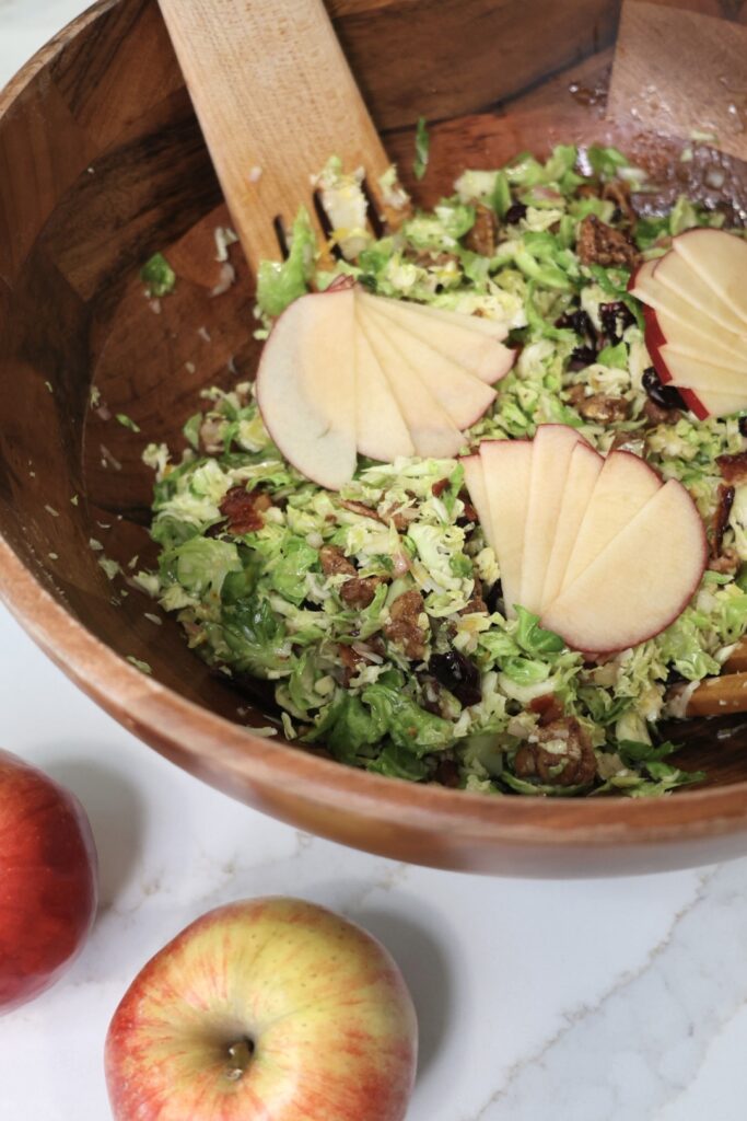brussels sprouts salad with candied walnuts and orange vinaigrette for fall. healthy fall salad recipe