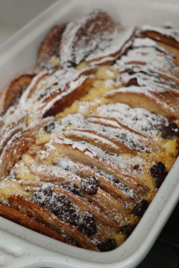Sliced chocolate chip pancake casserole fresh from the oven