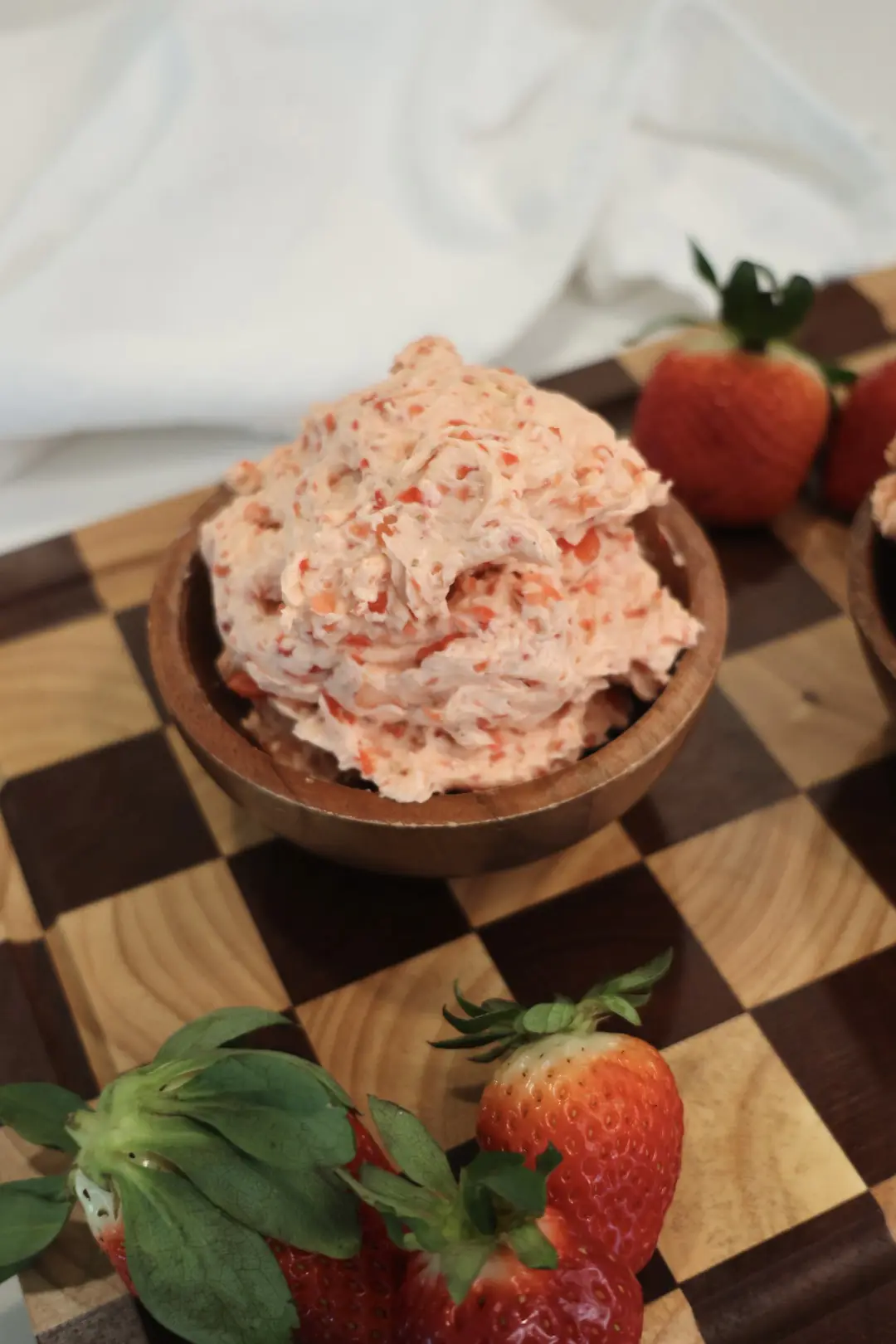 Light and fluffy pink strawberry honey butter close up