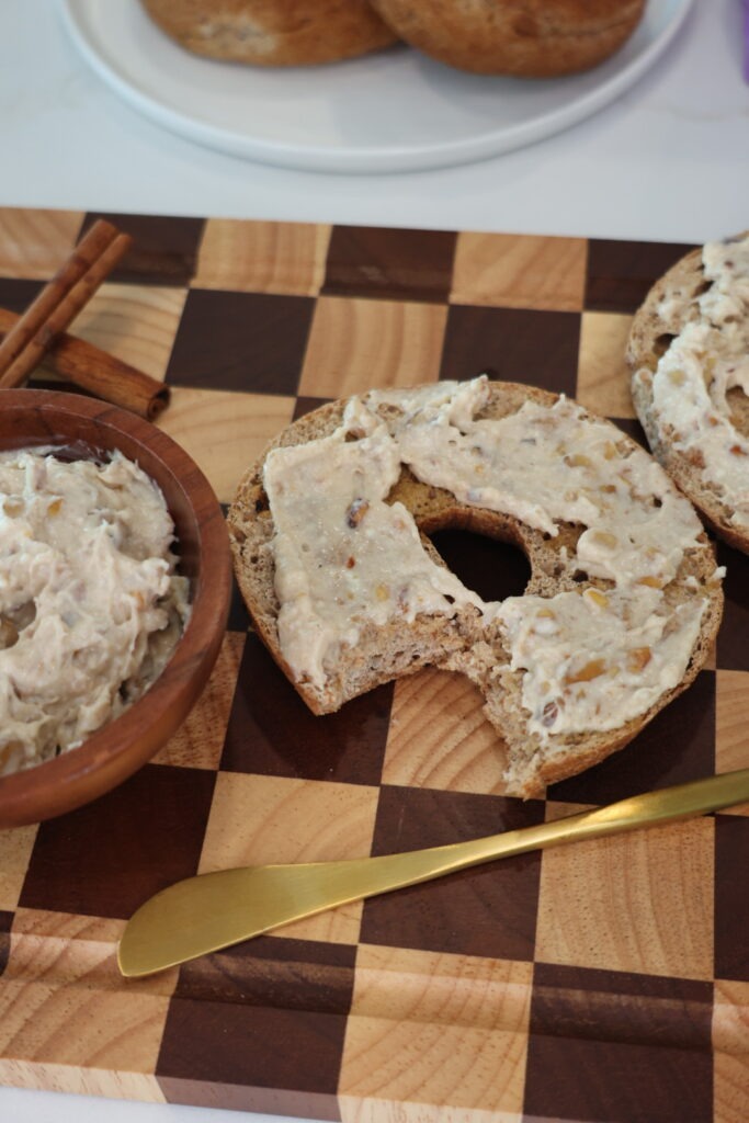 Thick honey walnut cream cheese spread over a toasted Eat Royo bagel