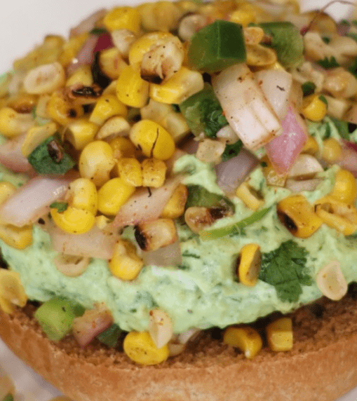 These Grilled Southwest Turkey Burgers are juicy, flavorful, and topped with fresh grilled corn salsa and creamy avocado crema. A high-protein, low-carb burger recipe that's perfect for summer grilling!