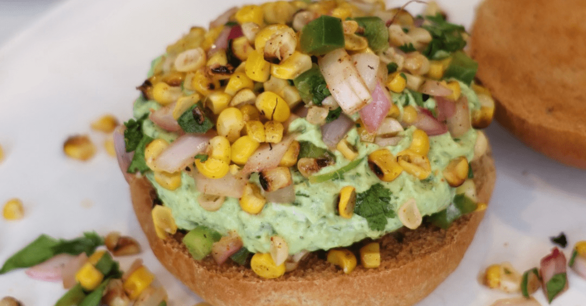 These Grilled Southwest Turkey Burgers are juicy, flavorful, and topped with fresh grilled corn salsa and creamy avocado crema. A high-protein, low-carb burger recipe that's perfect for summer grilling!