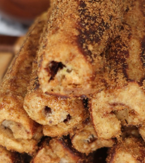 High Protein Chocolate Hazelnut French Toast Roll-Ups with a warm chocolate center and golden cinnamon coating.