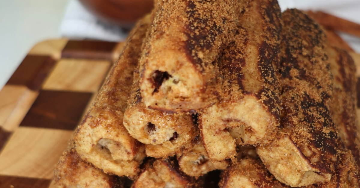 High Protein Chocolate Hazelnut French Toast Roll-Ups with a warm chocolate center and golden cinnamon coating.