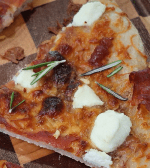 This Fig, Prosciutto & Goat Cheese Pizza is the perfect sweet and savory combination! Made with sourdough pizza crust, fig jam, prosciutto, mozzarella, and creamy goat cheese for an easy gourmet pizza at home.